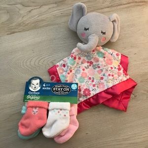 Bundle of baby socks and plush toy